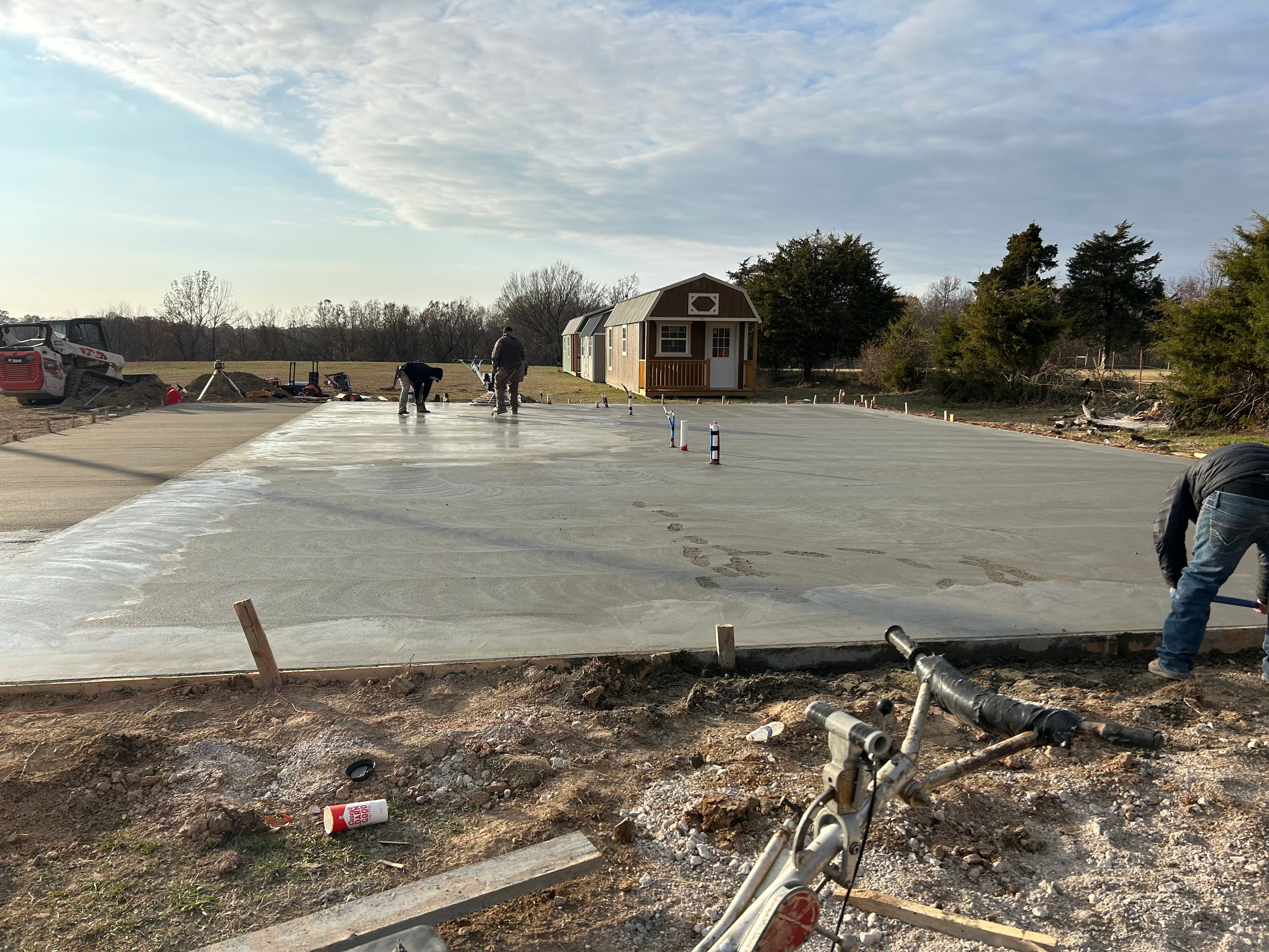 Concrete driveway with expansion joints and broom texture