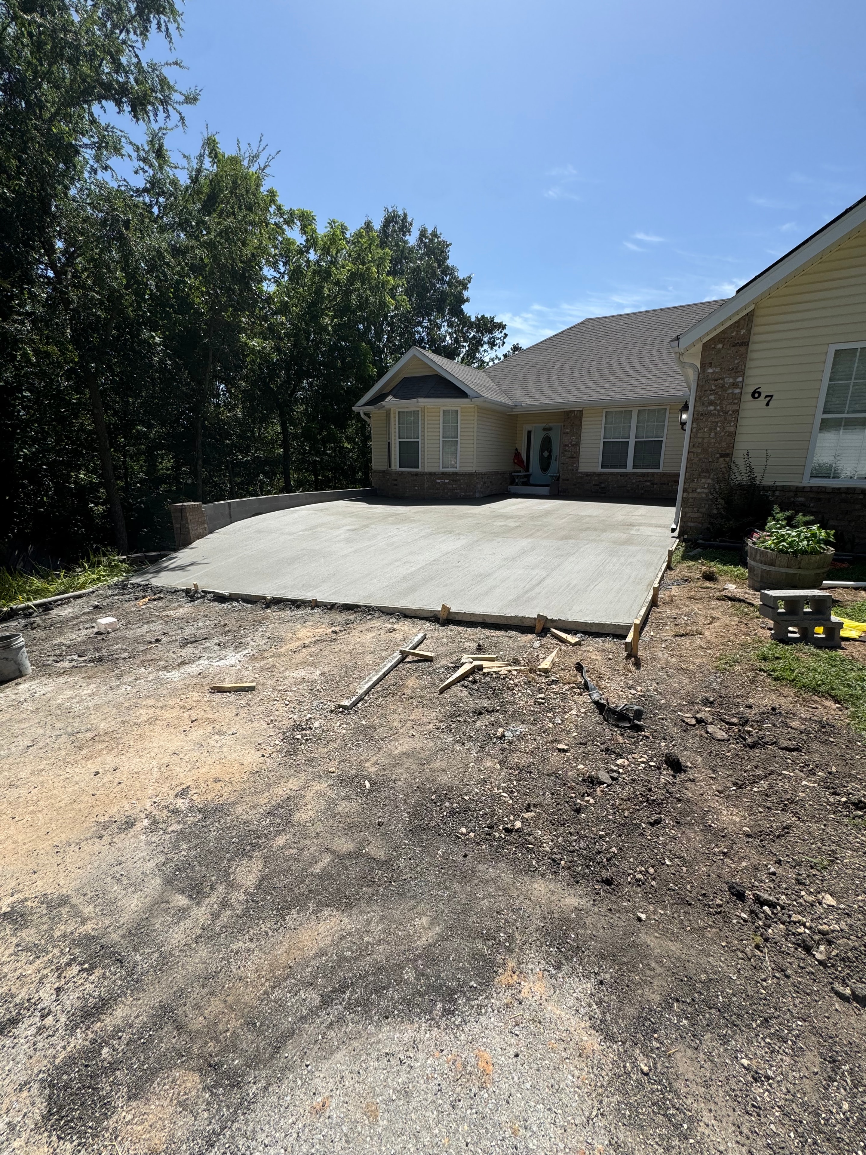Site excavation and grading for drainage improvement