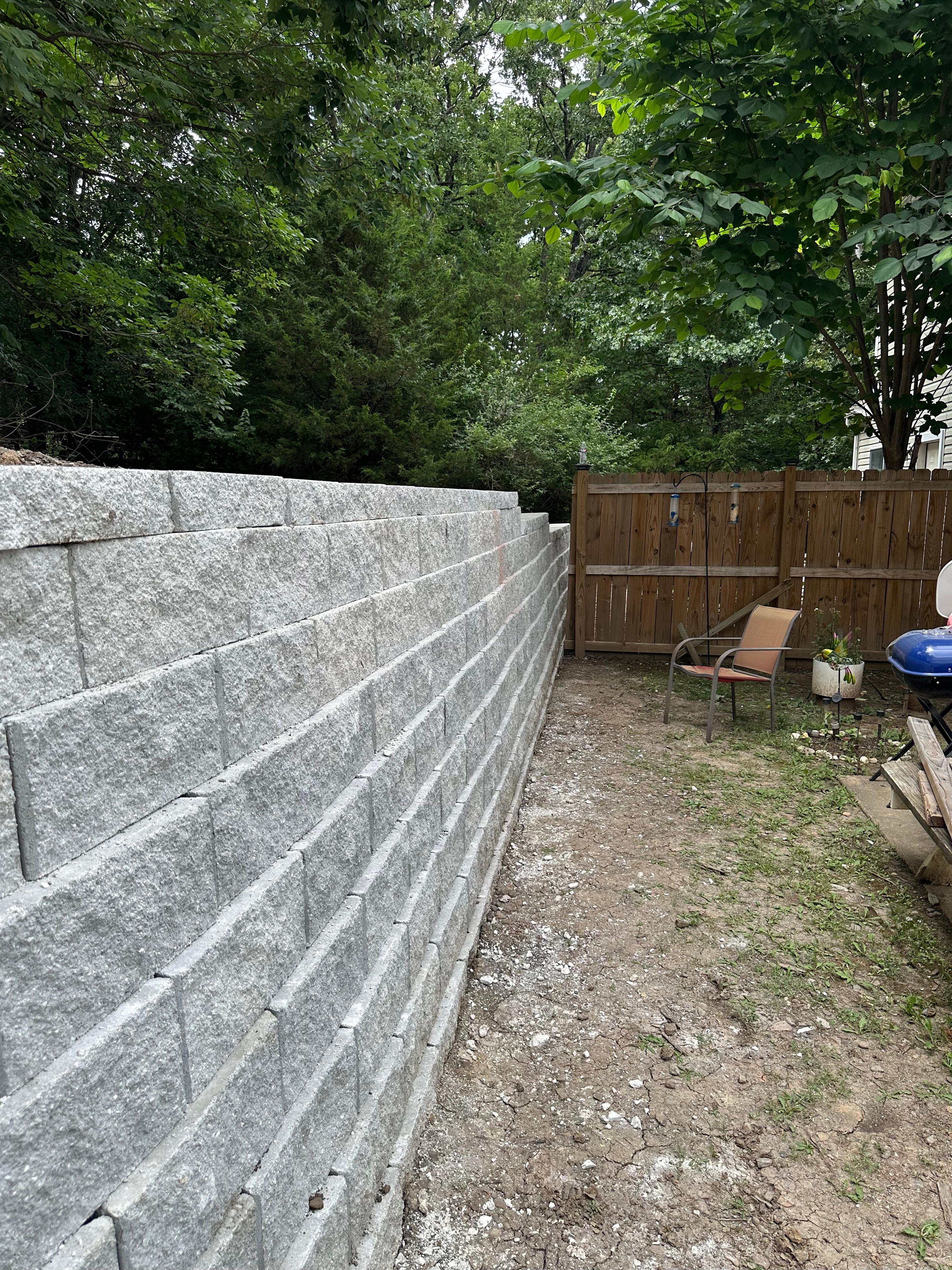 Stone paver pathway with retaining wall