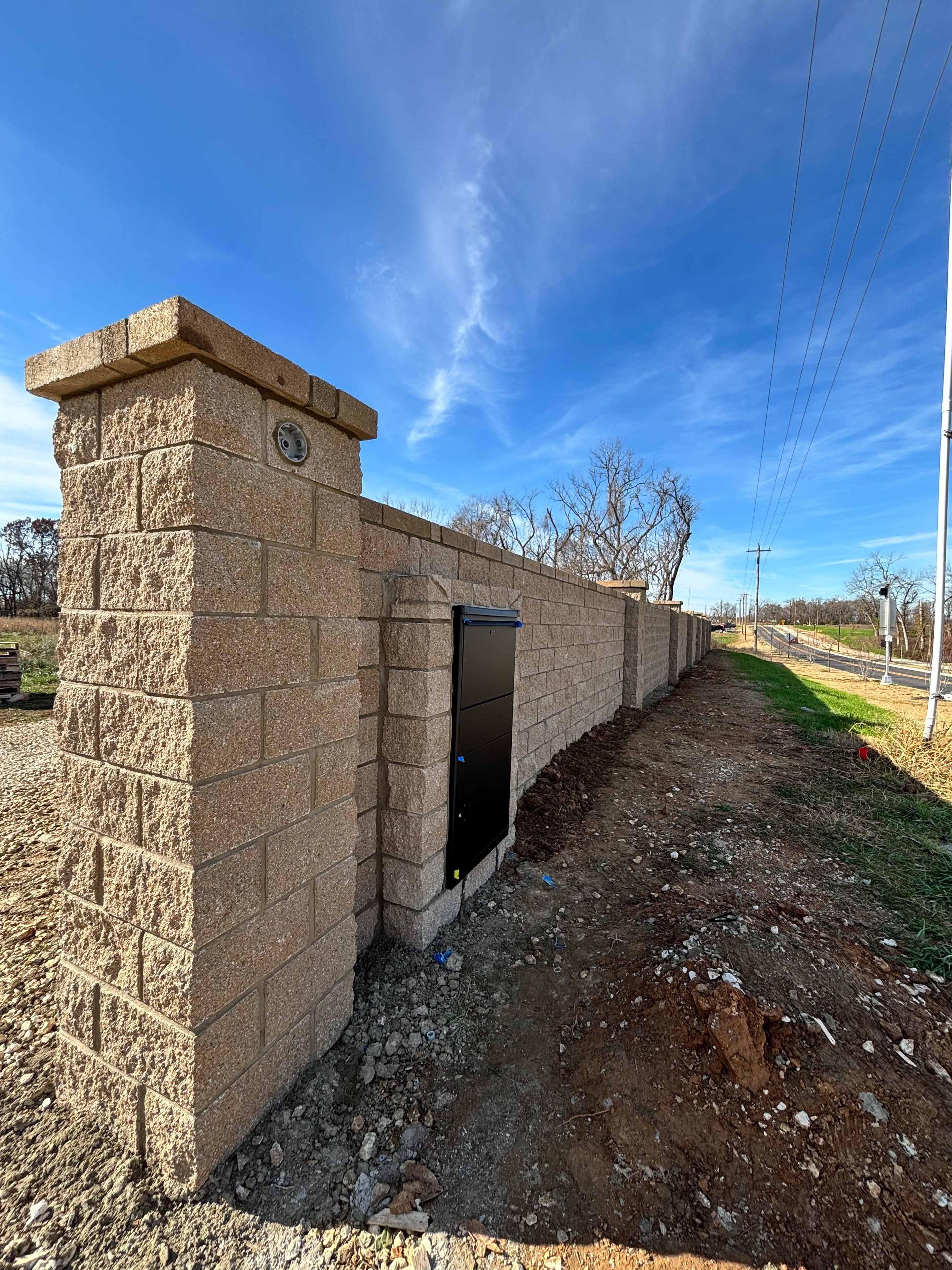 Stone pathway with retaining wall and gate