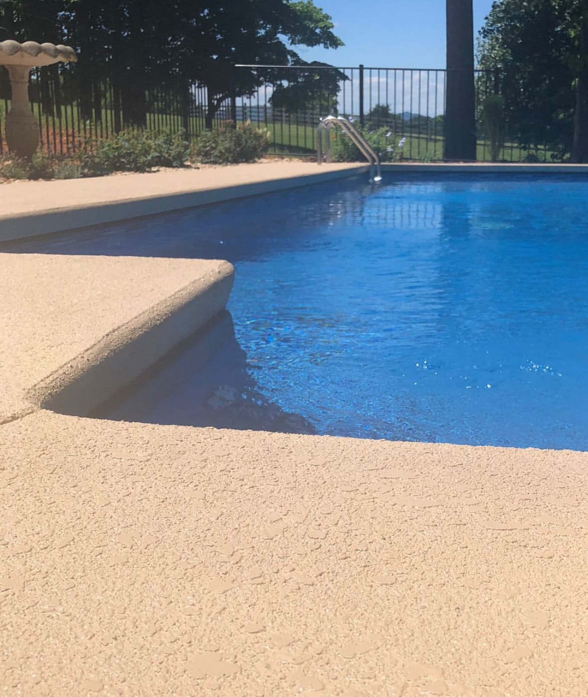 Finished pool deck with clean concrete edges